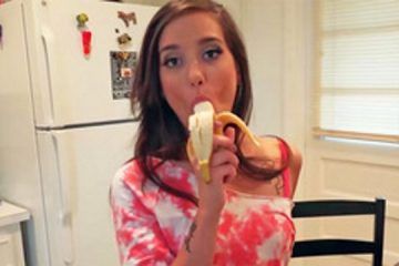 Naughty girl sucking a banana but wants to suck a dick