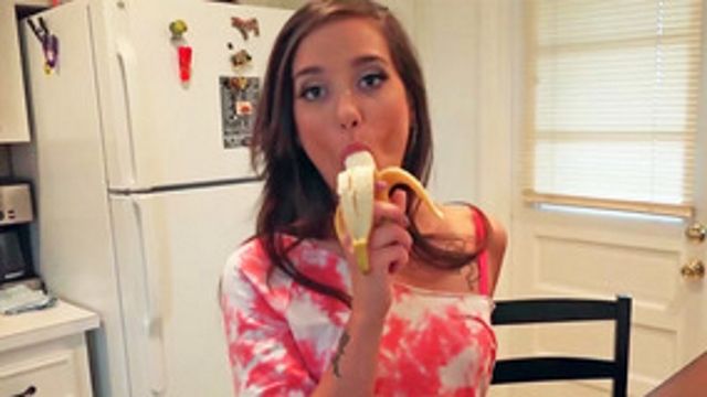 Naughty girl sucking a banana but wants to suck a dick